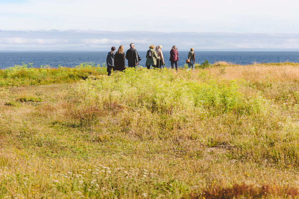 Guests gathering on the Newfoundland coast with their guide